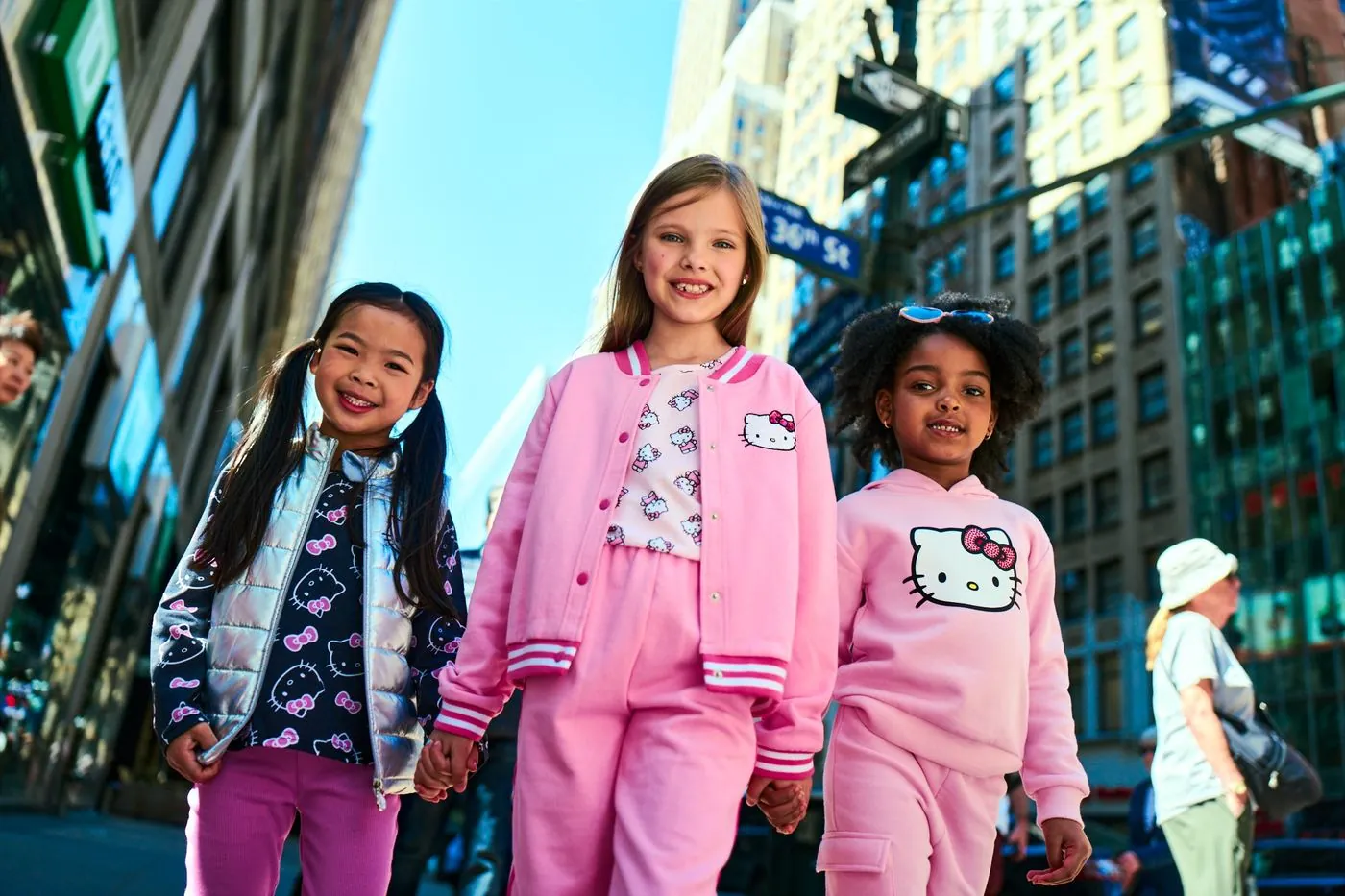 Three girls in Hello Kitty outfits on a Manhattan street